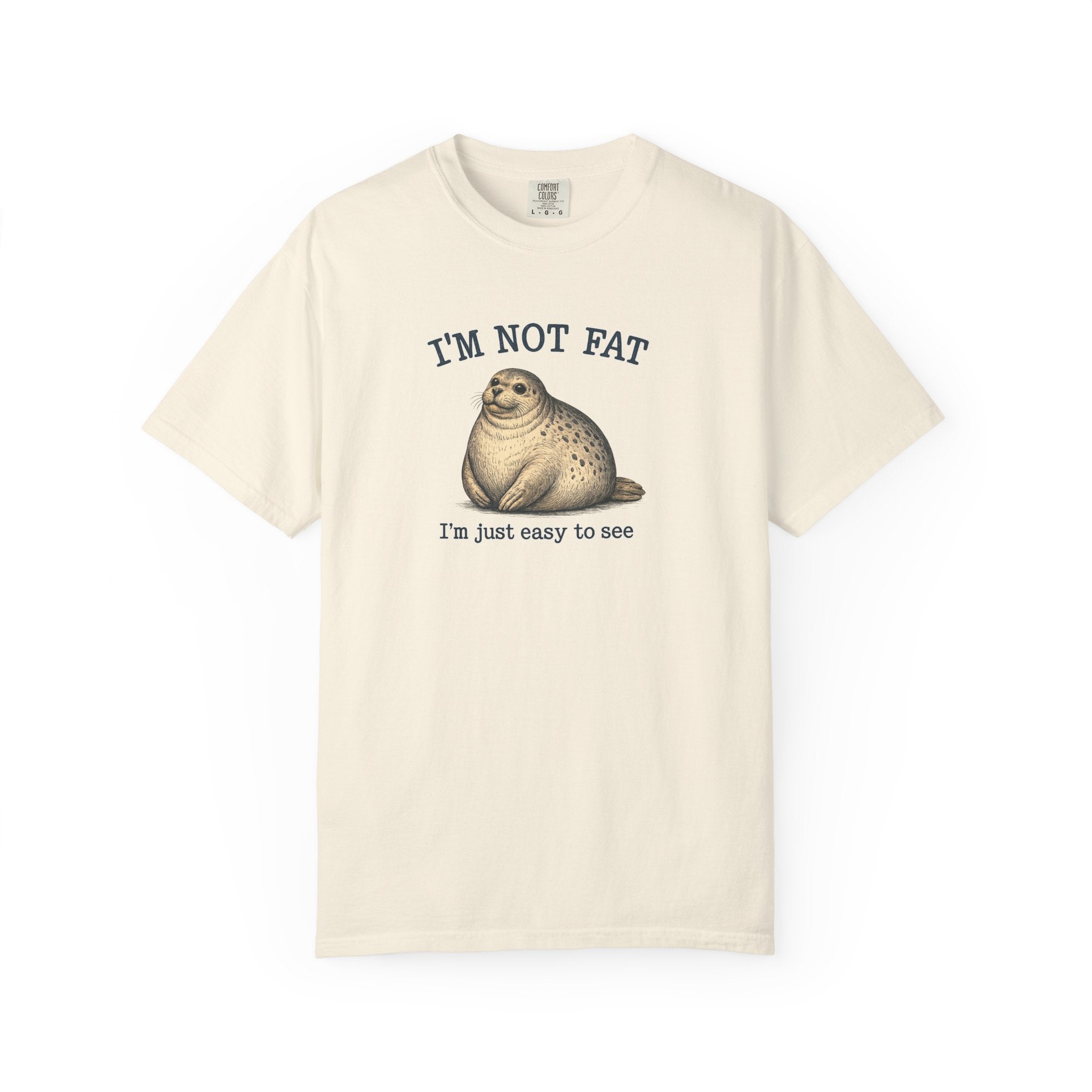 Beige t-shirt with a seal graphic and text on a white background