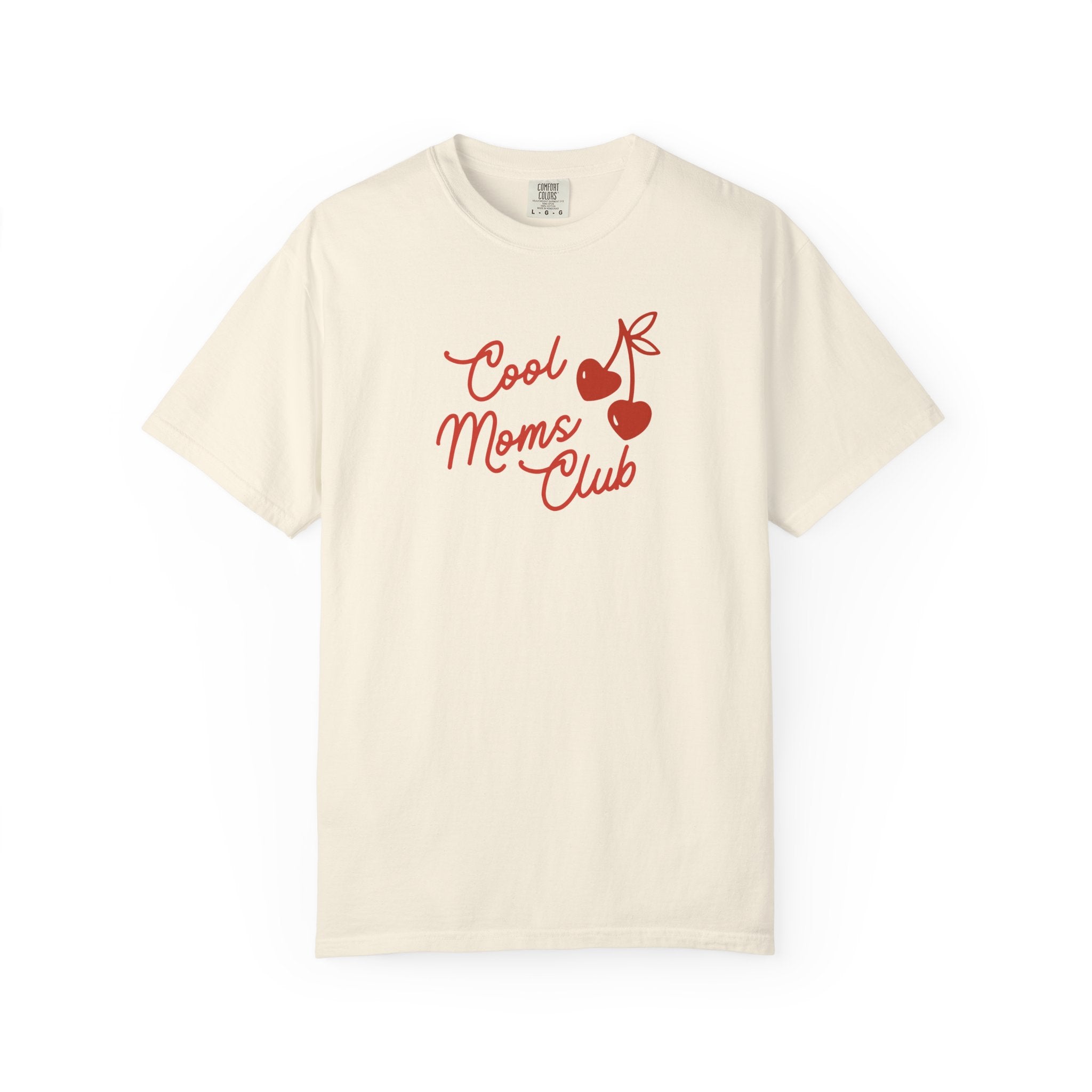 An off-white short-sleeve crewneck t-shirt featuring a red graphic print on the chest that reads 'Cool Moms Club' alongside two cherries and a heart.