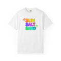 White t-shirt with 'Sun Salt Sand' text in colorful letters on a white background