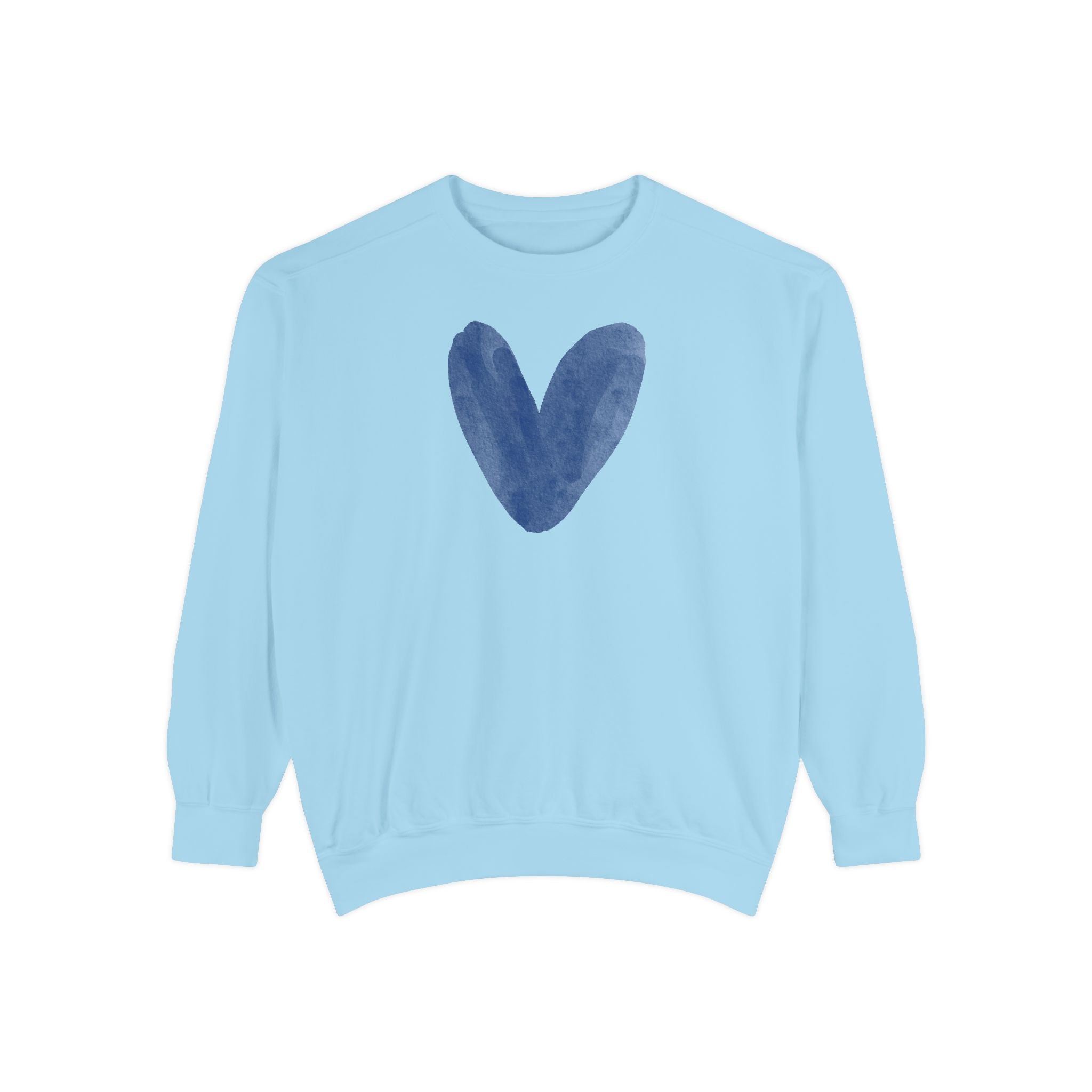 A light blue crewneck sweatshirt featuring a dark blue watercolor heart graphic on the chest, displayed against a solid white background.