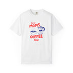 A white short-sleeve crewneck t-shirt featuring a graphic print on the front with the text 'Tired Moms Coffee Club' in red and blue, accompanied by illustrations of a coffee cup and a moka pot.
