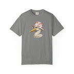 A gray short-sleeve crewneck t-shirt featuring a graphic print of a white seagull wearing a red and white patterned bucket hat, displayed against a solid white background.