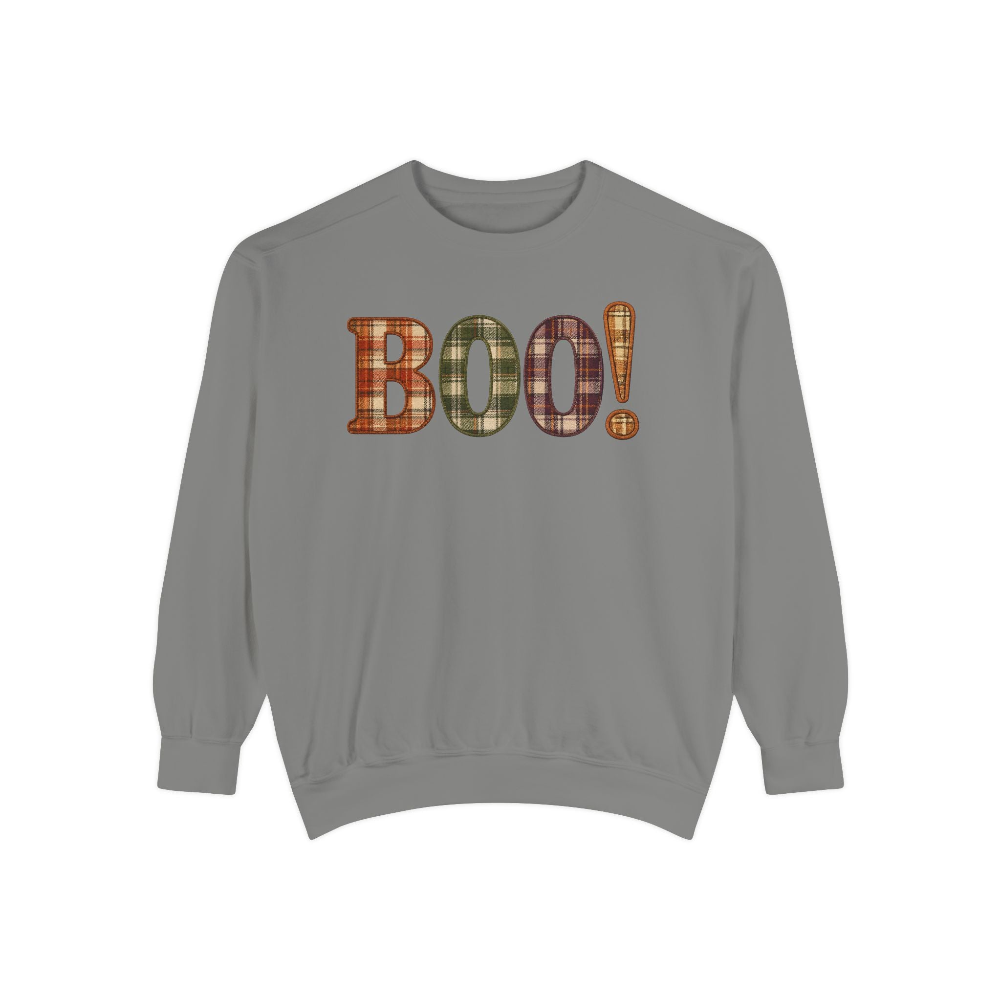 A gray crewneck sweatshirt featuring the word 'BOO!' in a plaid pattern across the chest, with an exclamation mark. The plaid pattern contains orange, green, and brown tones.