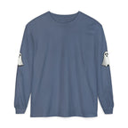A slate blue long-sleeve crewneck t-shirt with white ghost graphics printed on both upper sleeves, displayed flat against a solid white background.