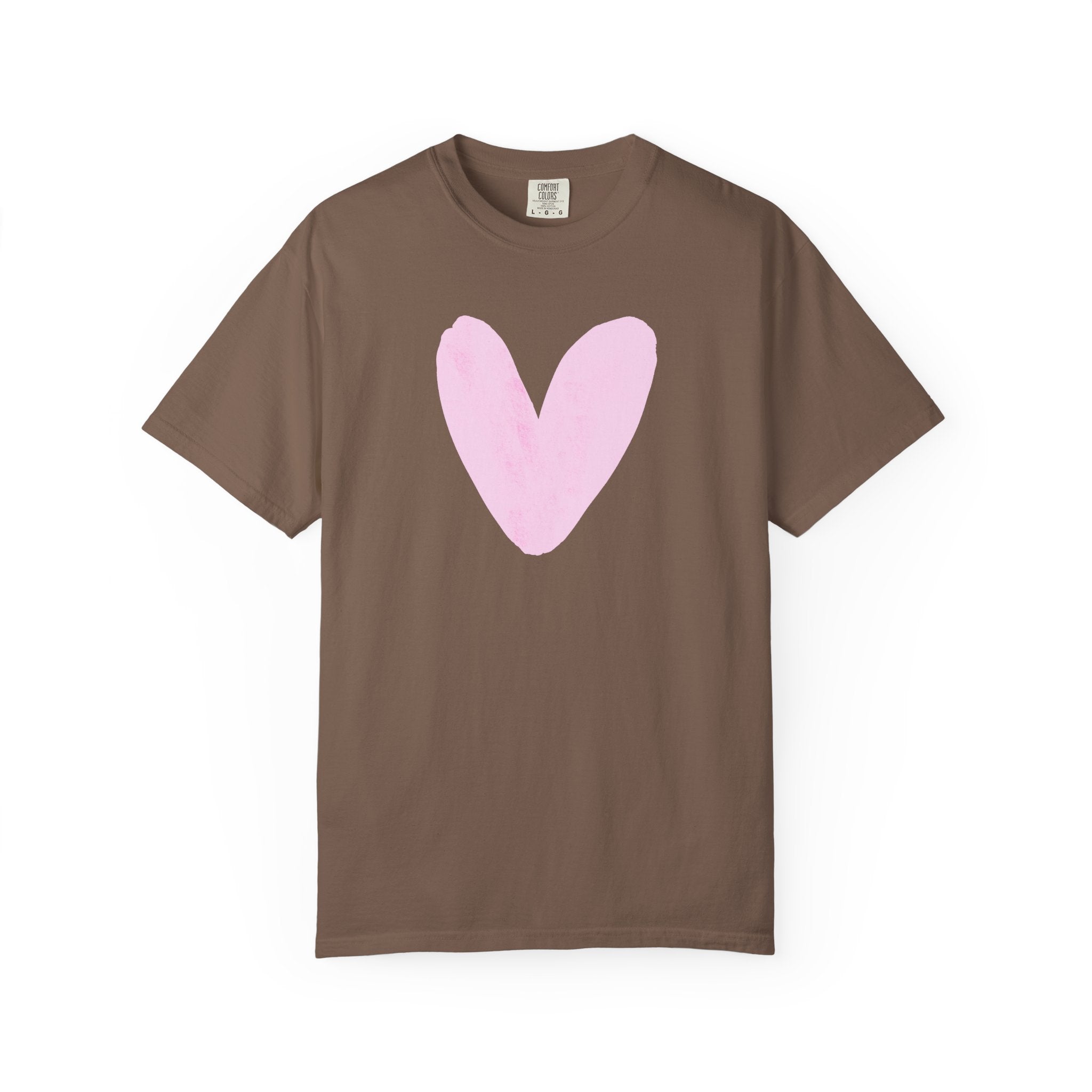 A brown short-sleeve crewneck t-shirt featuring a large, hand-drawn light pink heart on the chest, displayed against a solid white background.