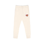 Beige sweatpants with a graphic design on a white background