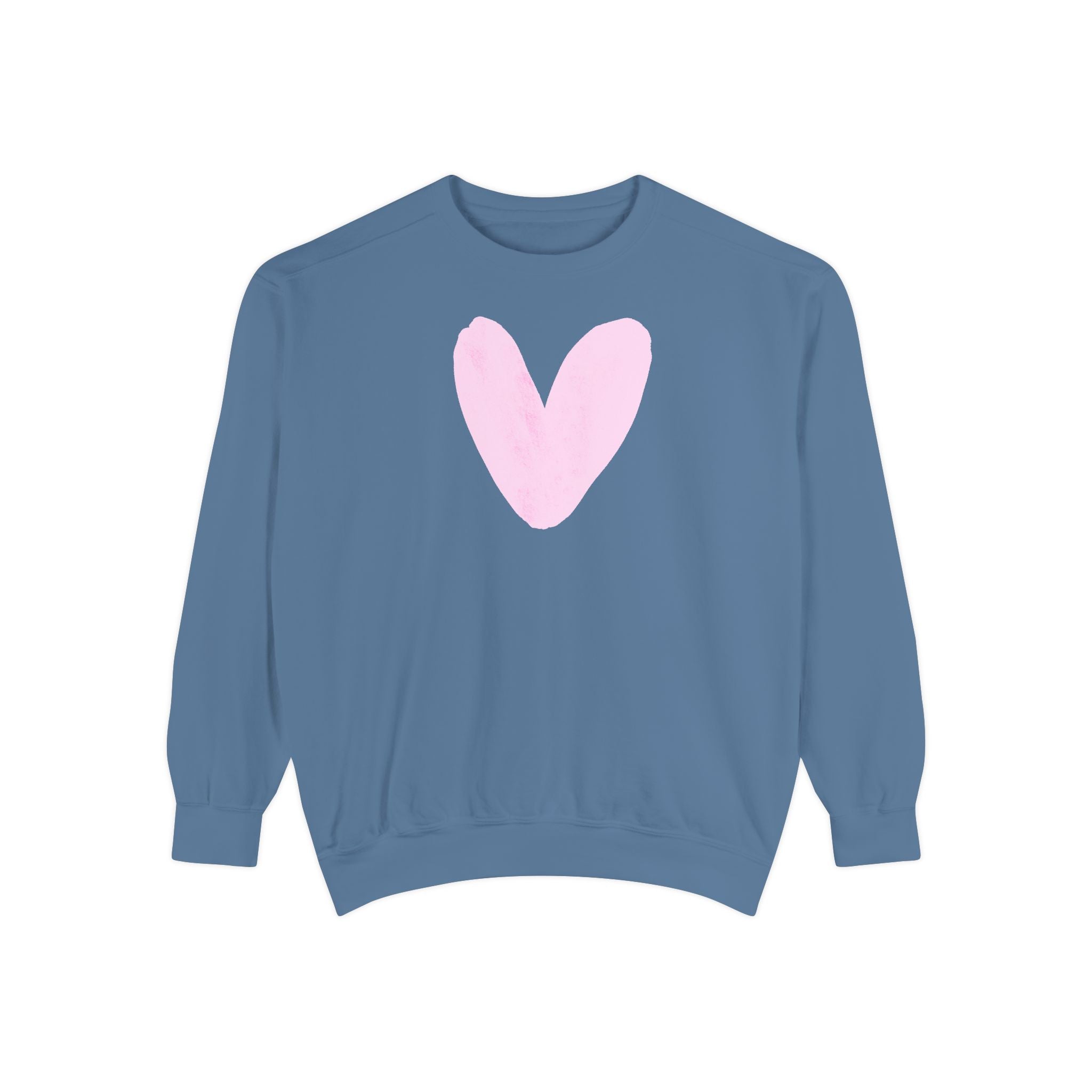 A dusty blue crewneck sweatshirt featuring a large, hand-drawn light pink heart on the chest, displayed against a solid white background.