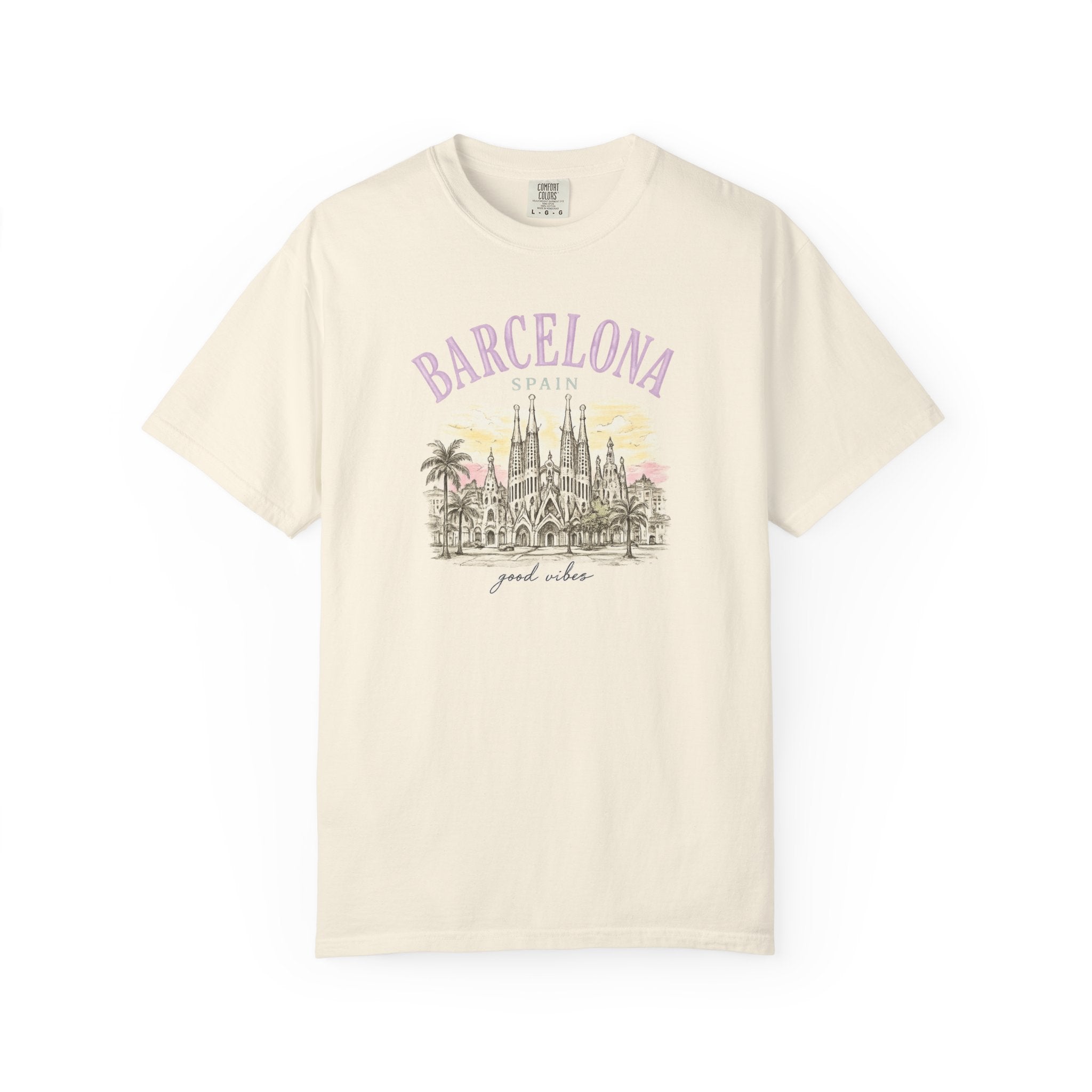 Beige t-shirt with 'Barcelona, Spain' and Sagrada Familia graphic on a white background