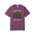 A purple short-sleeve crewneck t-shirt featuring a graphic of four girls dressed as witches with pumpkins, with the text 'PRETTY GIRLS WALK LIKE THIS' printed in white above and below the illustration.
