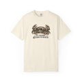 An off-white short-sleeve crewneck t-shirt featuring a graphic of a crab and the text 'IF CRABBY, RETURN TO BEACH' printed on the chest.