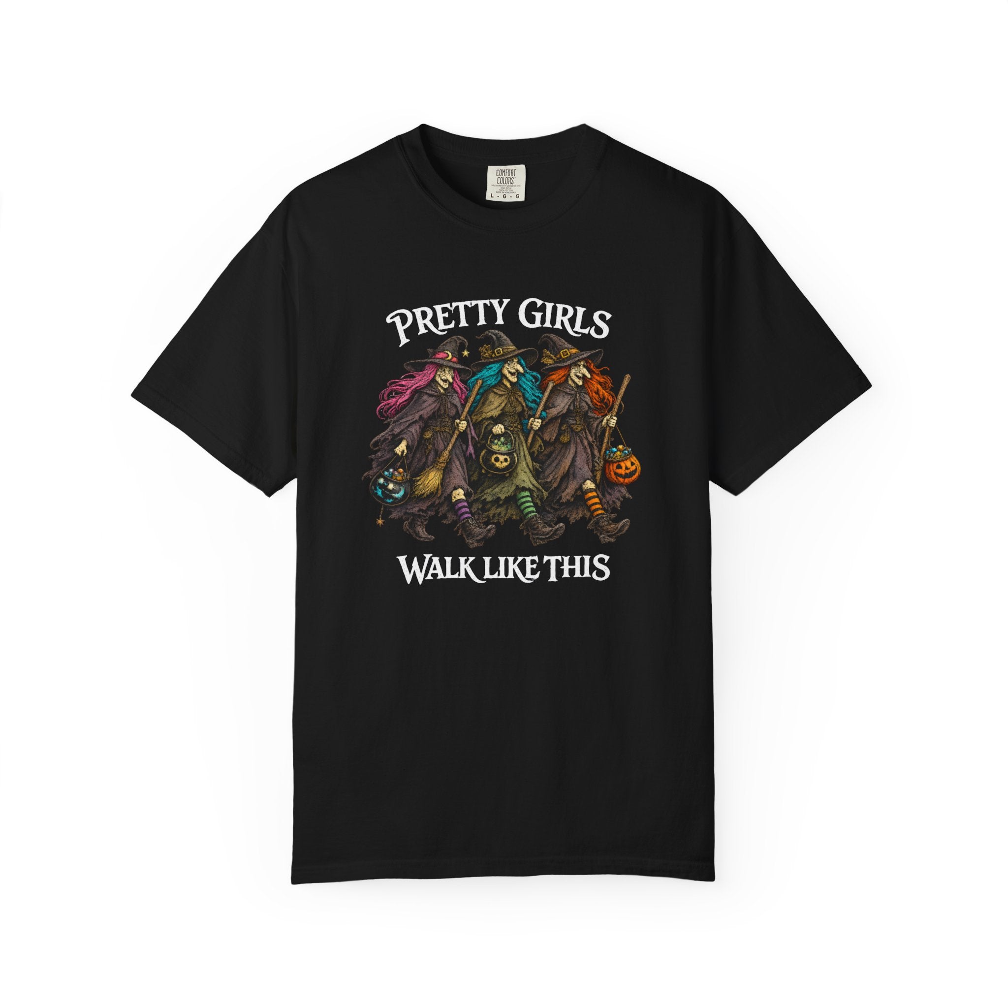 A black short-sleeve crewneck t-shirt featuring a graphic print of four witch characters with the text 'PRETTY GIRLS WALK LIKE THIS' in white, displayed against a plain white background.