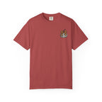 Maroon t-shirt with a small graphic on the chest against a white background