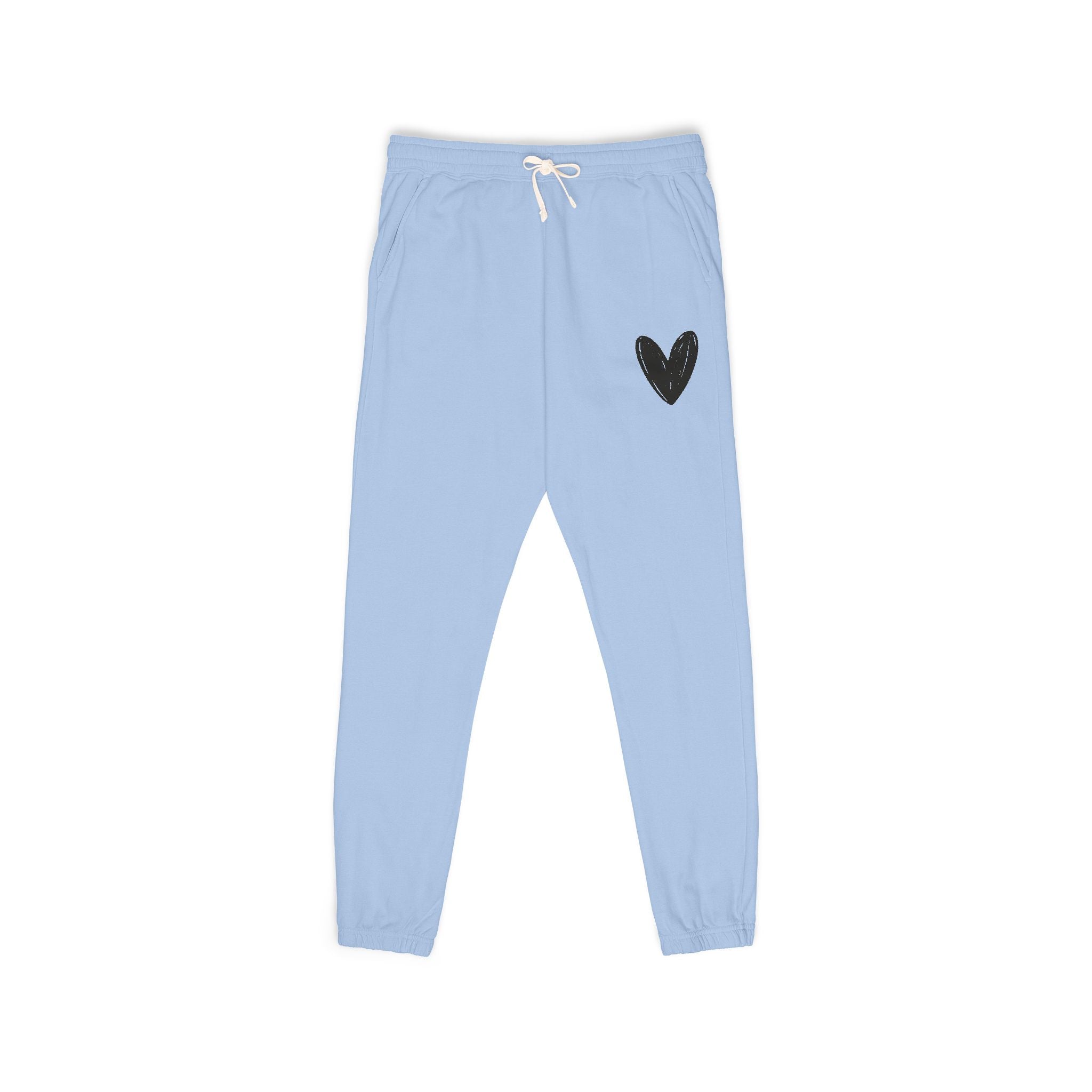 Light blue sweatpants with a small black heart graphic on the upper left leg and a white drawstring at the elastic waistband, shown flat on a white background.