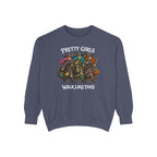 A slate blue crewneck sweatshirt featuring a graphic of three stylized girls dressed as witches with pumpkins, with the text 'PRETTY GIRLS WALK LIKE THIS' printed on the front.