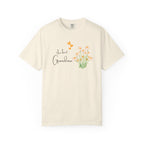 Beige t-shirt with 'the best Grandma' text and floral design on a white background