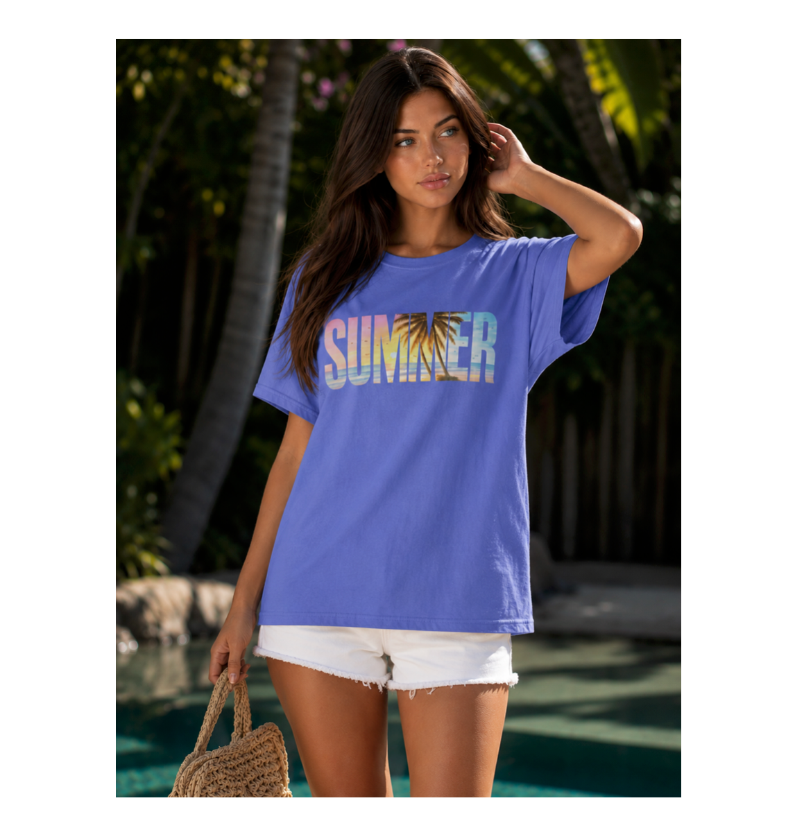 Woman wearing a blue 'Summer' t-shirt with palm tree design by a poolside.