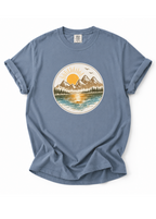 Blue t-shirt with a nature graphic on a white background