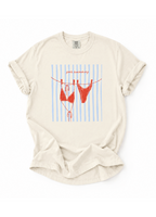 Beige t-shirt with red bikini graphic on a white background