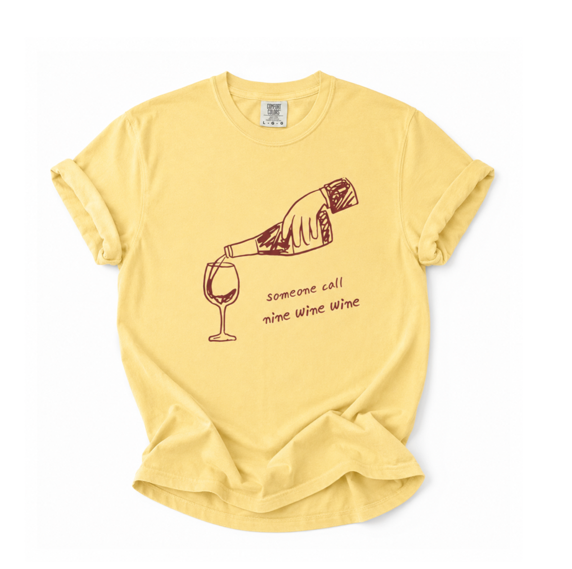 Yellow t-shirt with a graphic of a hand pouring wine into a glass and text on a white background