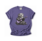 Purple t-shirt with an otter playing a guitar graphic on a white background