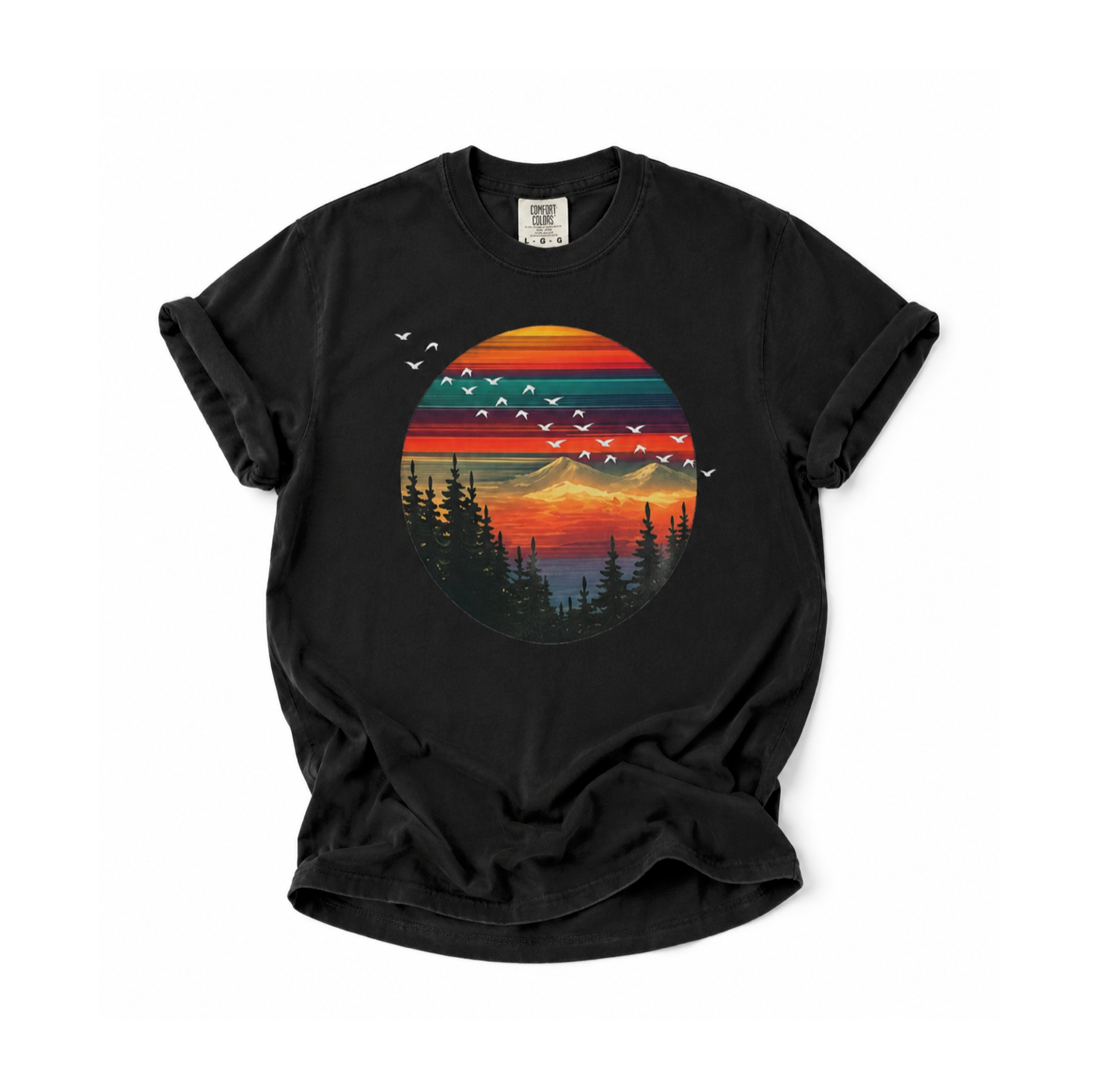 Black t-shirt with a colorful sunset and tree graphic on a white background