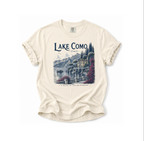 Beige t-shirt with 'Lake Como, Italy' graphic design on a white background