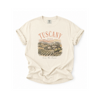 Beige t-shirt with 'Tuscany, Italy' graphic on a white background