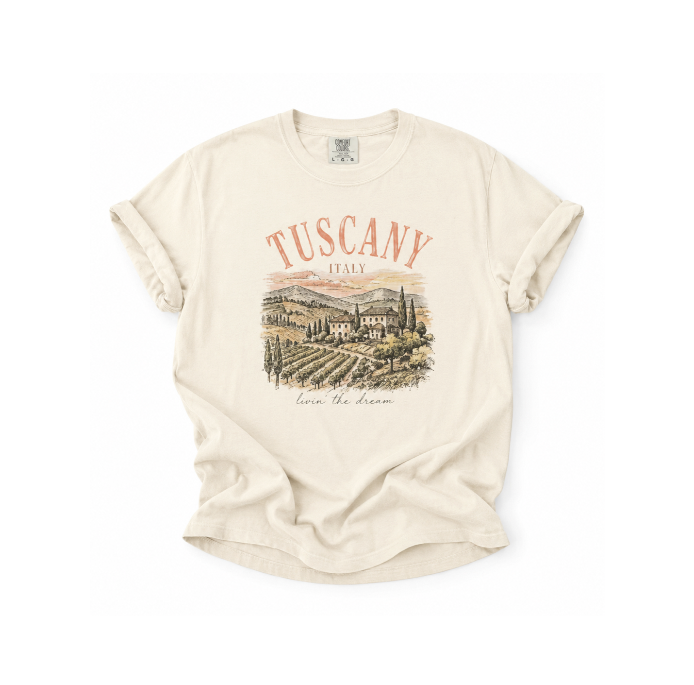 Beige t-shirt with 'Tuscany, Italy' graphic on a white background
