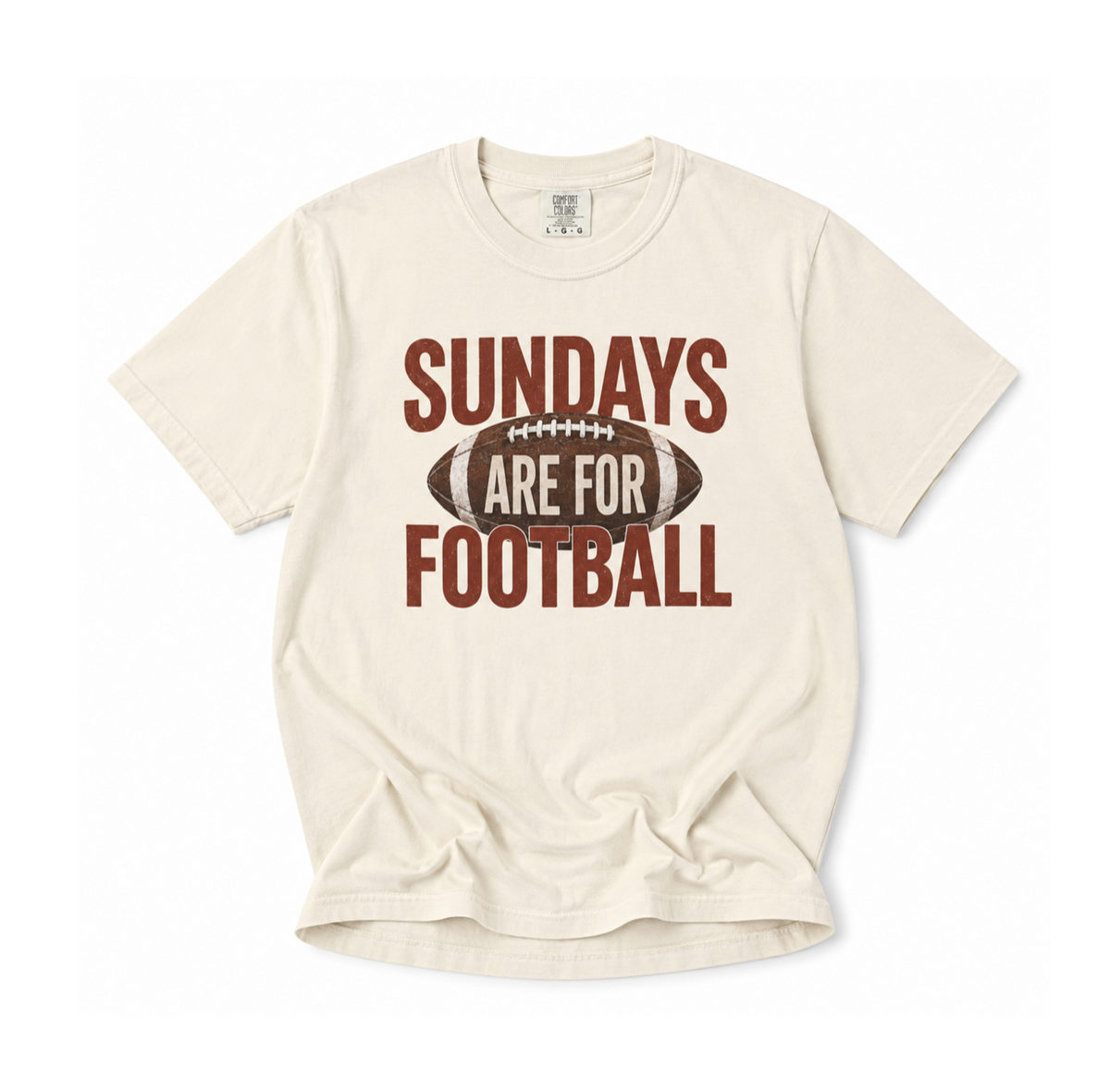 A cream-colored short-sleeve t-shirt with a distressed graphic that reads 'SUNDAYS ARE FOR FOOTBALL' in brown, featuring a football design in the center.