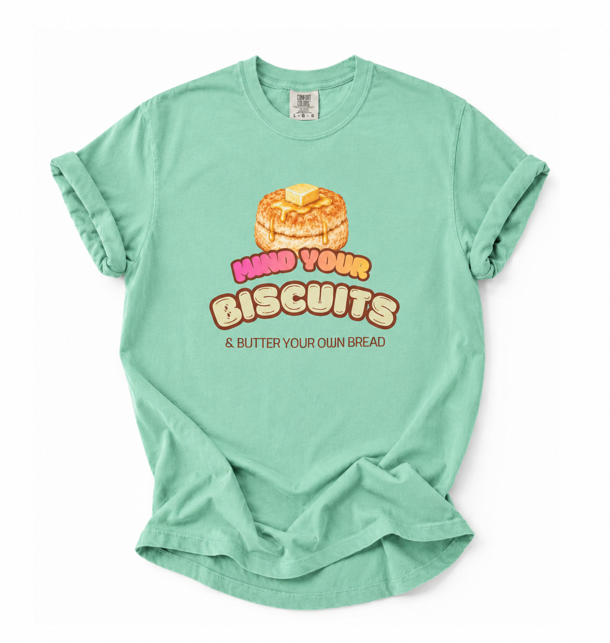 Mint green t-shirt with a graphic of biscuits and text on a white background
