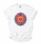 White t-shirt with a colorful mandala design on a white background
